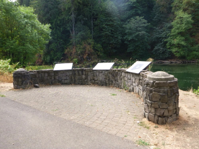 Interpretive displays on curved rock wall